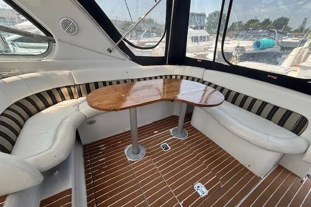 Slide: The Image of Interior of 2005 Four Winns 378 Vista yacht with cozy cabin and mounted TV. - 11