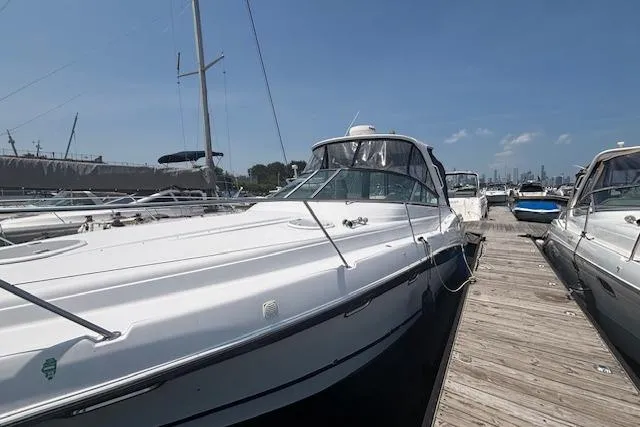 Slide: The Image of Interior of 2005 Four Winns 378 Vista yacht with cozy seating and wood finishes. - 12