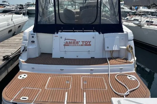 Slide: The Image of 2005 Four Winns 378 Vista boat helm with steering wheel and navigation instruments. - 2