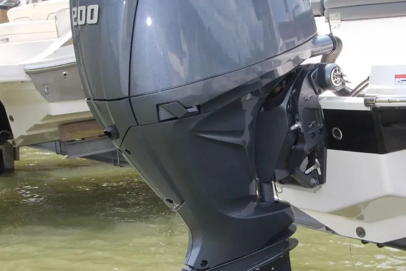 Slide: The Image of 2024 Chaparral 235 SSi OB boat with powerful outboard motor in water. - 18