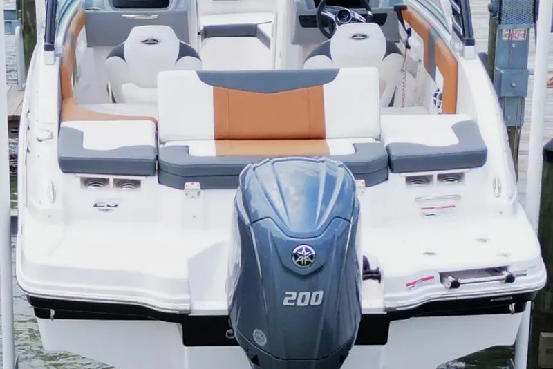 Slide: The Image of 2024 Chaparral 235 SSi OB boat with powerful outboard motor, sleek seating design. - 19