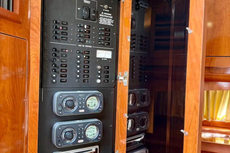 Slide: The Image of Control panel of 2008 Four Winns V358 boat with audio system and switches. - 11