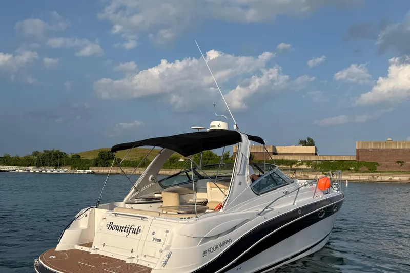 Slide: The Image of 2008 Four Winns V358 boat docked on a sunny day with clear skies. - 5