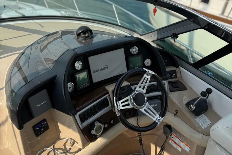 Slide: The Image of 2008 Four Winns V358 boat dashboard with Garmin navigation system and steering wheel. - 7