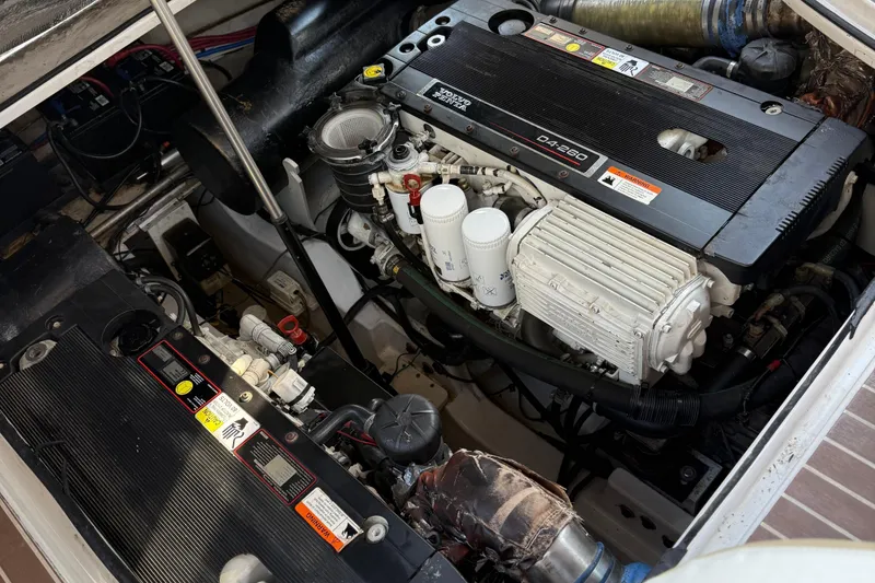 Slide: The Image of Engine compartment of a 2008 Four Winns V358 boat, showcasing detailed mechanical components. - 8