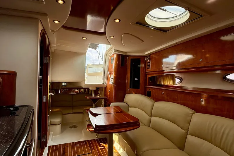 Slide: The Image of Luxurious interior of 2008 Four Winns V358 yacht with elegant wood finishes. - 9