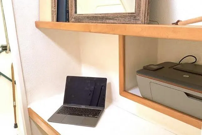 Slide: The Image of Workspace with laptop and printer on a Voyage 440, 2001 model. - 17