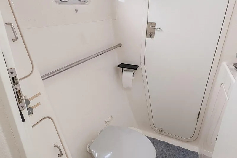 Slide: The Image of Compact bathroom interior of 2001 Voyage 440 yacht, featuring toilet and door. - 18