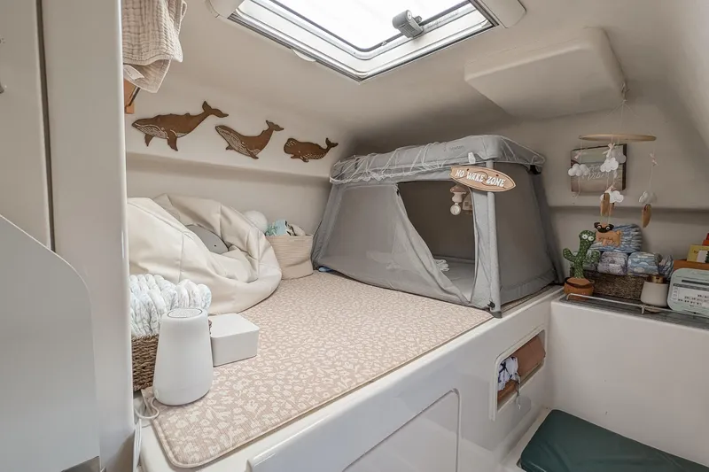 Slide: The Image of Cozy cabin interior of 2001 Voyage 440 yacht with baby sleeping area. - 25