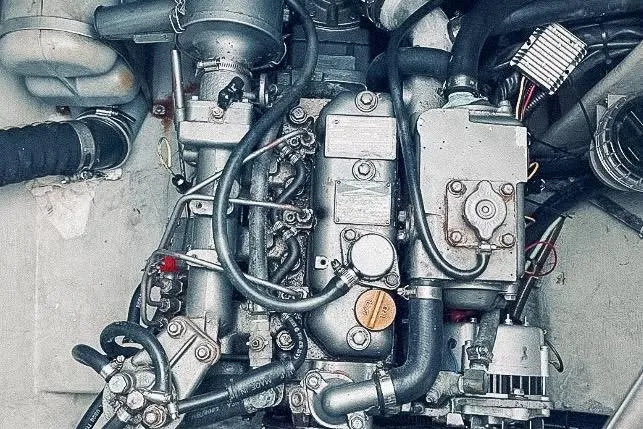 Slide: The Image of Engine of a 2001 Voyage 440 sailboat, showcasing intricate mechanical components. - 35