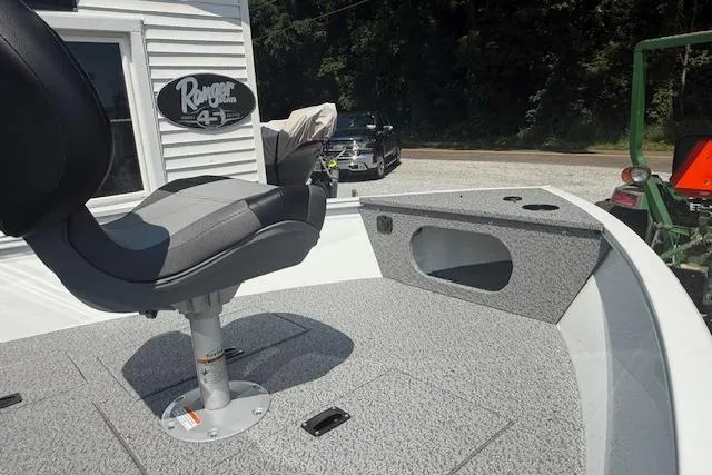 Slide: The Image of 2026 Crestliner 1650 Kodiak boat interior with seating and storage compartments. - 6