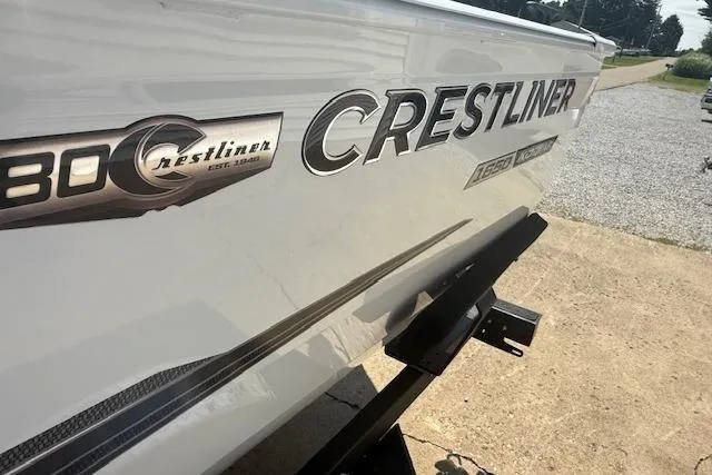 Slide: The Image of 2026 Crestliner 1650 Kodiak boat side view with logo and trailer. - 8
