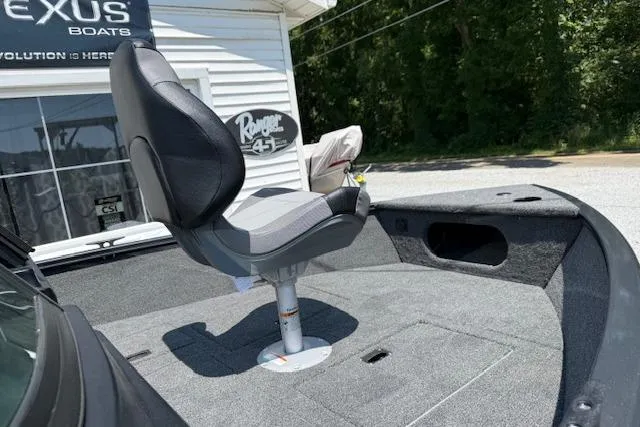 Slide: The Image of 2026 Crestliner 1650 Kodiak boat seat on deck, outdoor showroom display. - 6