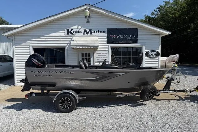 The Image of 2026 Crestliner 1650 Kodiak boat on trailer outside Knox Marine dealership. - 1