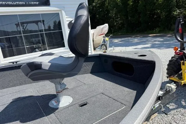 Slide: The Image of 2026 Crestliner 1650 Kodiak boat interior with swivel seat and carpeted deck. - 6