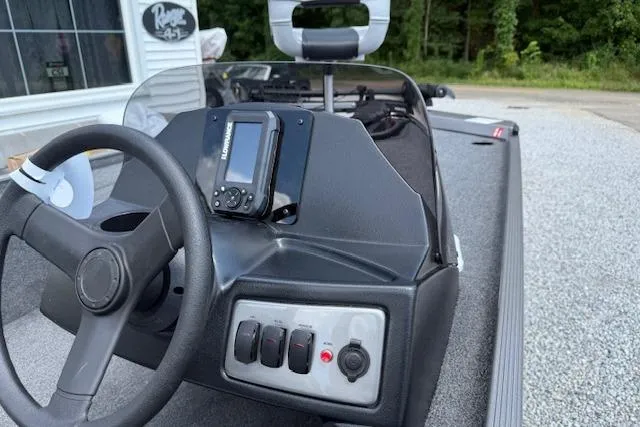 Slide: The Image of 2026 Crestliner 1600 Storm boat dashboard with steering wheel and control panel. - 5