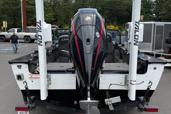 Slide: The Image of 2020 Lund 1875 Pro-V Sport boat with Talon anchors and powerful outboard motor. - 2