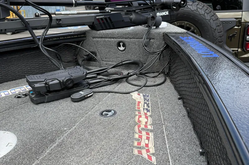 Slide: The Image of 2020 Lund 1875 Pro-V Sport boat deck with Mercury branding and electronic equipment. - 7