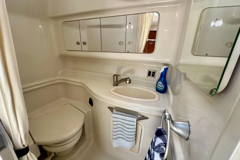 Slide: The Image of Bathroom interior of 2008 Sea Ray 340 Sundancer yacht, featuring sink and toilet. - 104