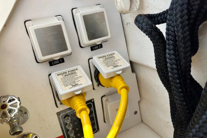 Slide: The Image of Shore power connections on a 2008 Sea Ray 340 Sundancer boat with yellow cables. - 110