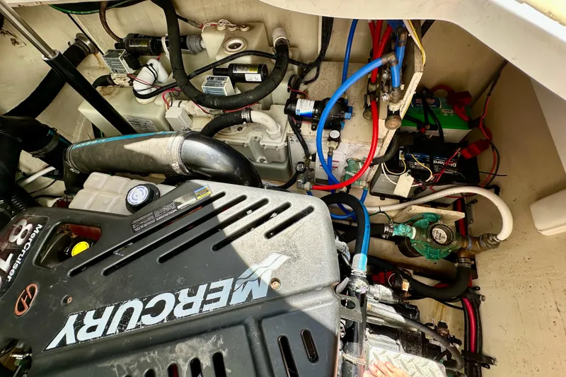 Slide: The Image of Engine compartment of a 2008 Sea Ray 340 Sundancer with Mercury components and wiring. - 114