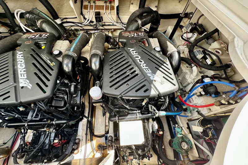 Slide: The Image of Engine compartment of a 2008 Sea Ray 340 Sundancer with twin Mercury engines. - 116