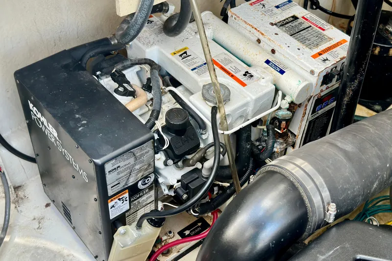 Slide: The Image of Engine compartment of a 2008 Sea Ray 340 Sundancer with Kohler power systems. - 122