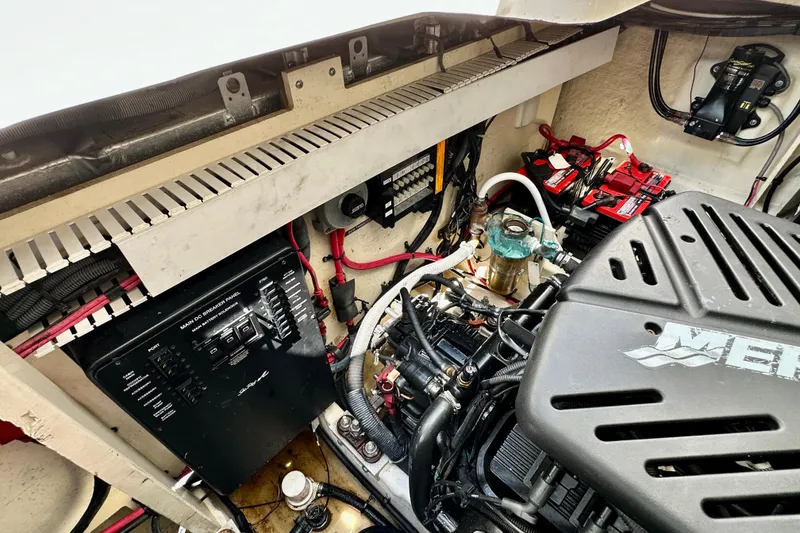 Slide: The Image of Engine compartment of a 2008 Sea Ray 340 Sundancer, featuring electrical panel and components. - 125