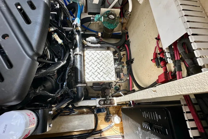 Slide: The Image of Engine compartment of a 2008 Sea Ray 340 Sundancer boat, showcasing mechanical components. - 127
