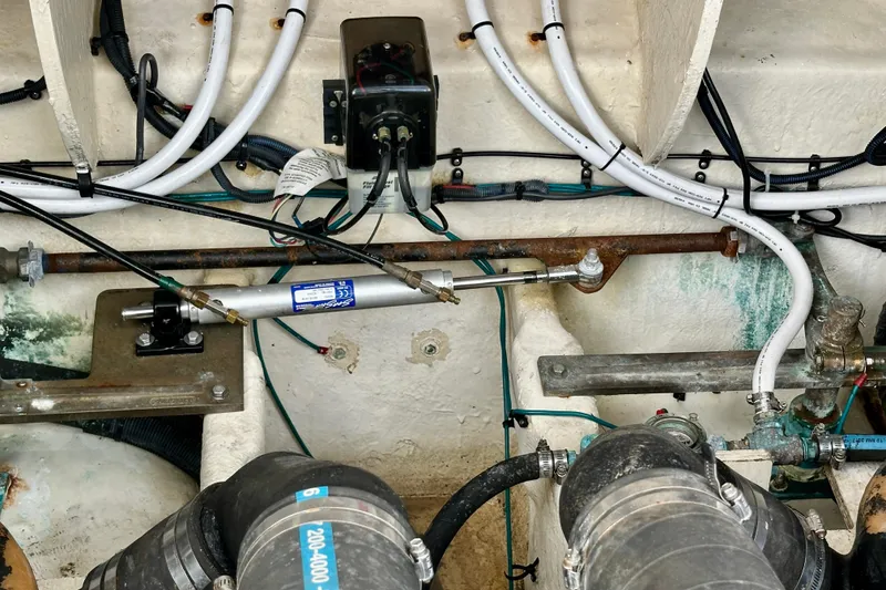 Slide: The Image of Engine compartment of a 2008 Sea Ray 340 Sundancer with visible wiring and components. - 128