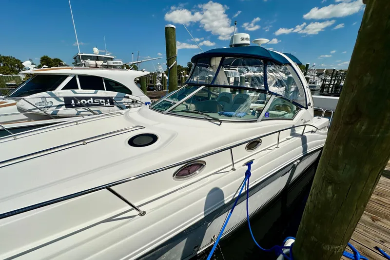 Slide: The Image of 2008 Sea Ray 340 Sundancer docked at marina under clear blue sky. - 13