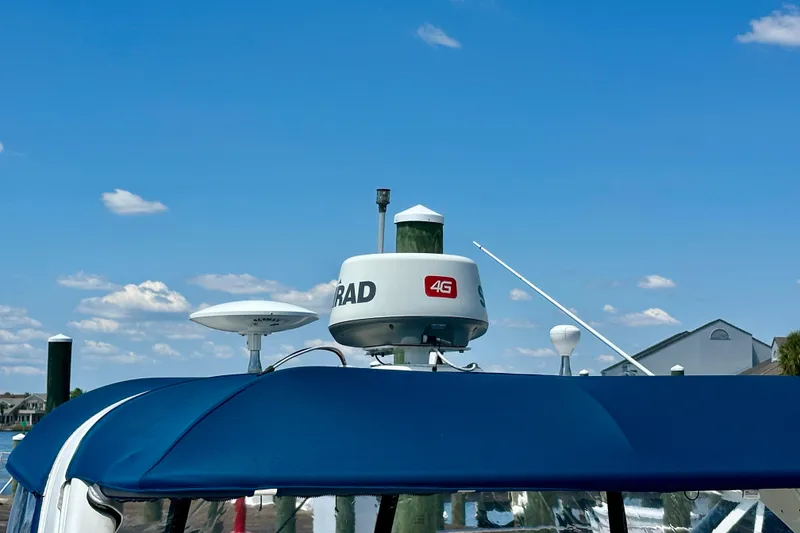 Slide: The Image of Radar equipment on a 2008 Sea Ray 340 Sundancer against a clear blue sky. - 14