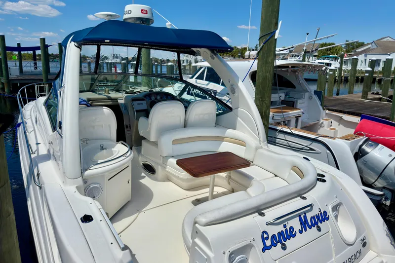 Slide: The Image of 2008 Sea Ray 340 Sundancer yacht docked, featuring spacious seating and sleek design. - 18