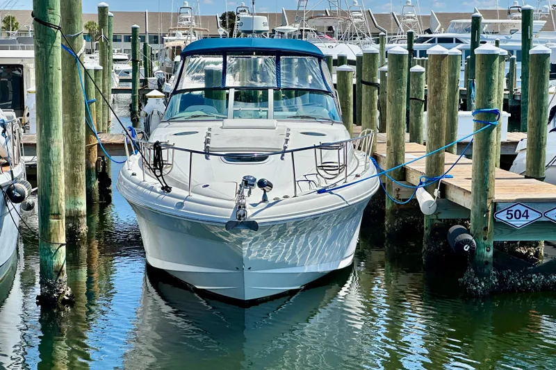 Slide: The Image of 2008 Sea Ray 340 Sundancer docked at marina, surrounded by wooden piers. - 20