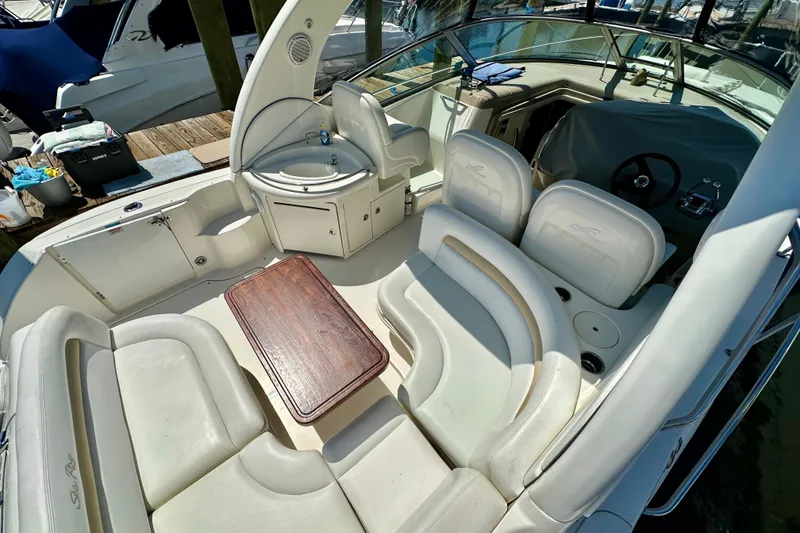 Slide: The Image of 2008 Sea Ray 340 Sundancer boat interior with seating, table, and helm. - 24