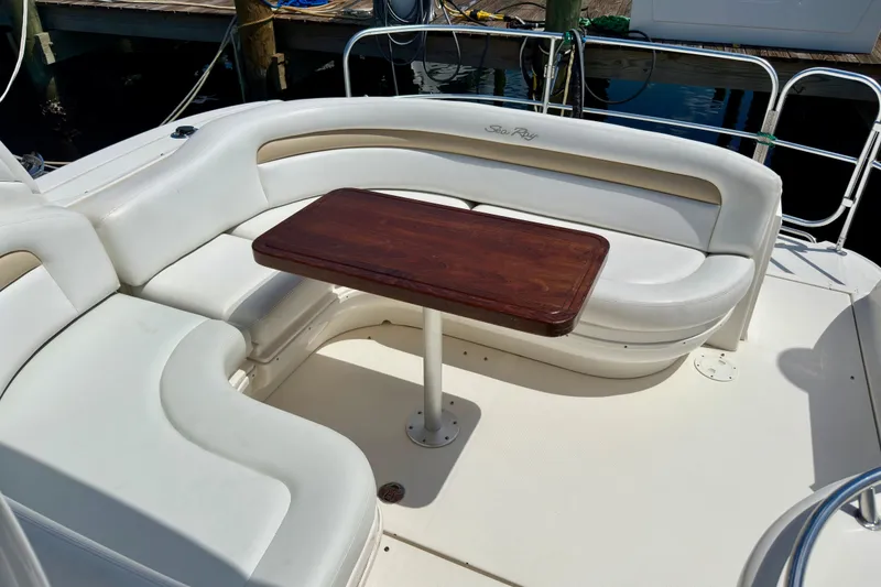 Slide: The Image of Luxurious seating area on a 2008 Sea Ray 340 Sundancer yacht with wooden table. - 26