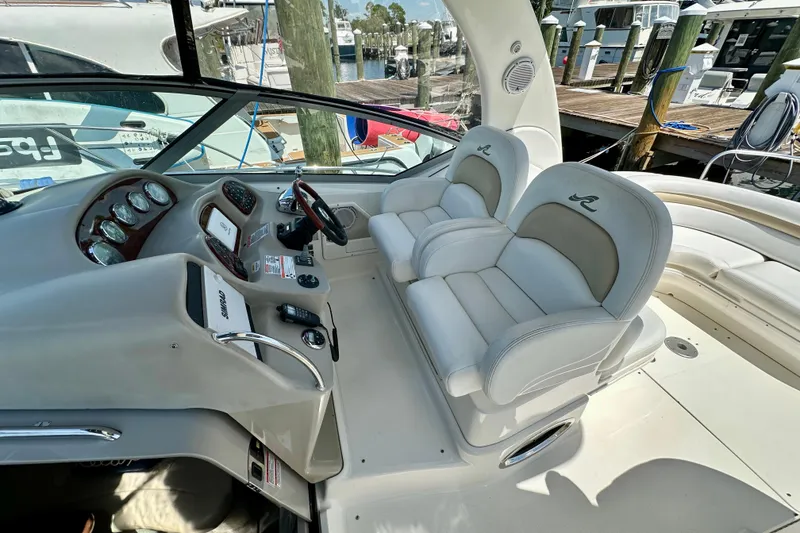 Slide: The Image of 2008 Sea Ray 340 Sundancer cockpit with dual helm seats and control panel. - 32