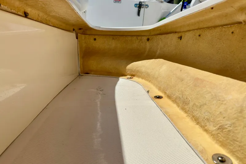 Slide: The Image of Interior view of a 2008 Sea Ray 340 Sundancer boat, showcasing seating and fiberglass details. - 45