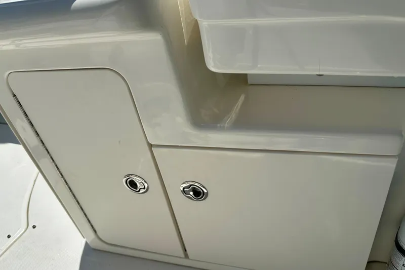 Slide: The Image of 2008 Sea Ray 340 Sundancer boat storage compartment with sleek white finish. - 57