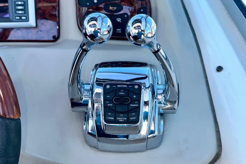 Slide: The Image of Chrome throttle controls on 2008 Sea Ray 340 Sundancer boat dashboard. - 69