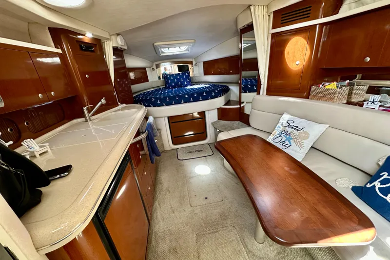 Slide: The Image of Luxurious interior of 2008 Sea Ray 340 Sundancer yacht with kitchen and seating area. - 74
