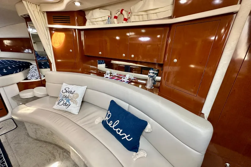 Slide: The Image of Luxurious 2008 Sea Ray 340 Sundancer interior with plush seating and nautical decor. - 77