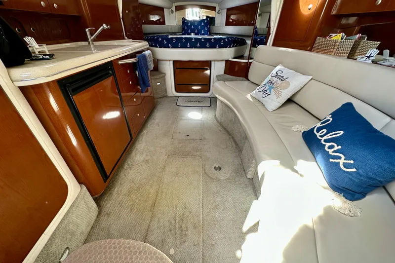 Slide: The Image of Luxurious interior of 2008 Sea Ray 340 Sundancer with cozy seating and elegant wood finishes. - 83