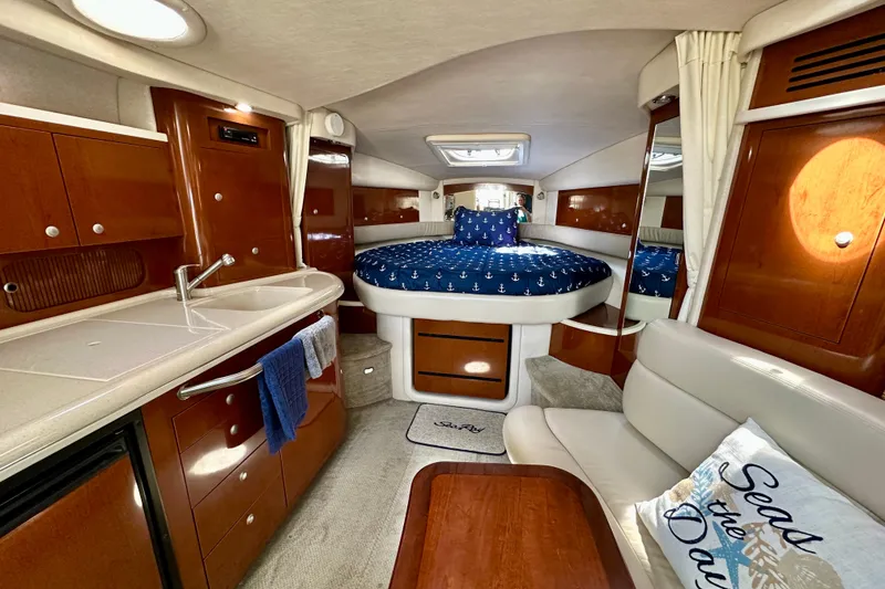 Slide: The Image of Luxurious interior of 2008 Sea Ray 340 Sundancer yacht with cozy bed and kitchenette. - 85