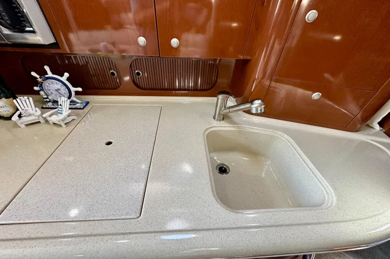 Slide: The Image of Luxurious kitchen area in 2008 Sea Ray 340 Sundancer yacht with sink and decor. - 90