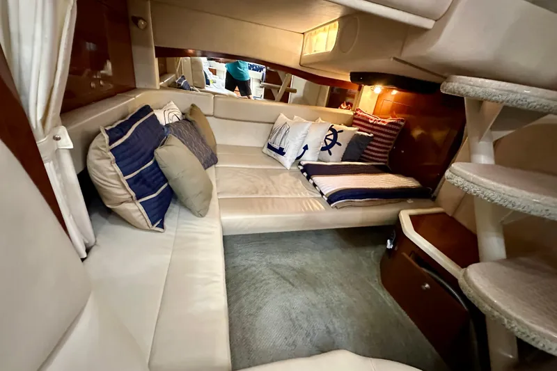 Slide: The Image of Luxurious interior of 2008 Sea Ray 340 Sundancer with plush seating and nautical decor. - 95