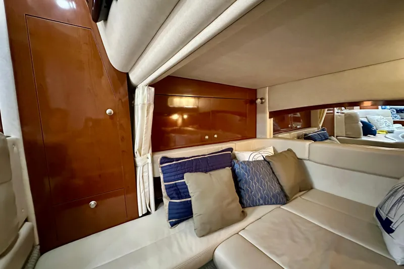 Slide: The Image of Luxurious interior of 2008 Sea Ray 340 Sundancer with plush seating and decorative pillows. - 97