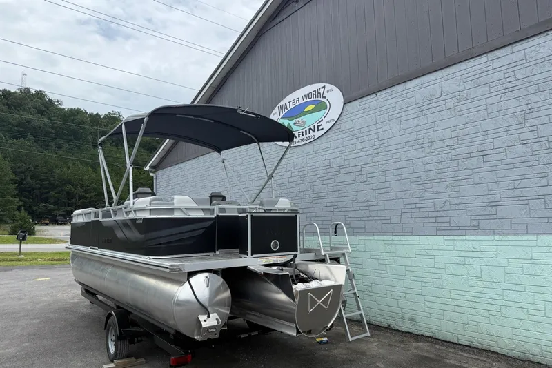 Slide: The Image of 2025 Avalon Venture Quad Lounger 2180 pontoon boat outside Water Workz Marine. - 4