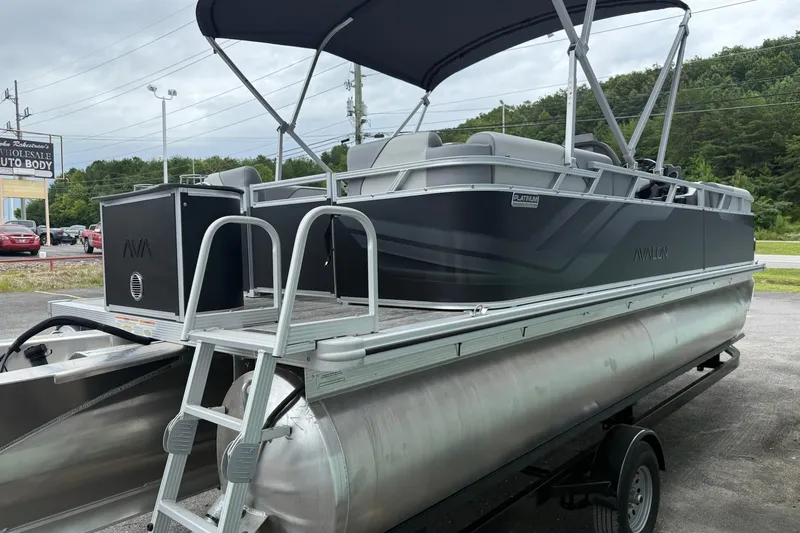 Slide: The Image of 2025 Avalon Venture Quad Lounger 2180 pontoon boat with canopy on trailer. - 5