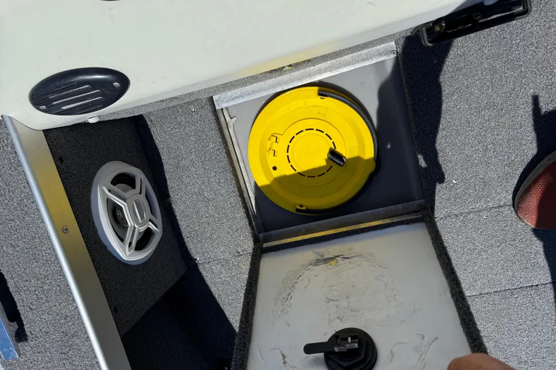 Slide: The Image of 1999 Alumacraft Tournament Pro 175 CS boat interior with speaker and storage compartment. - 15